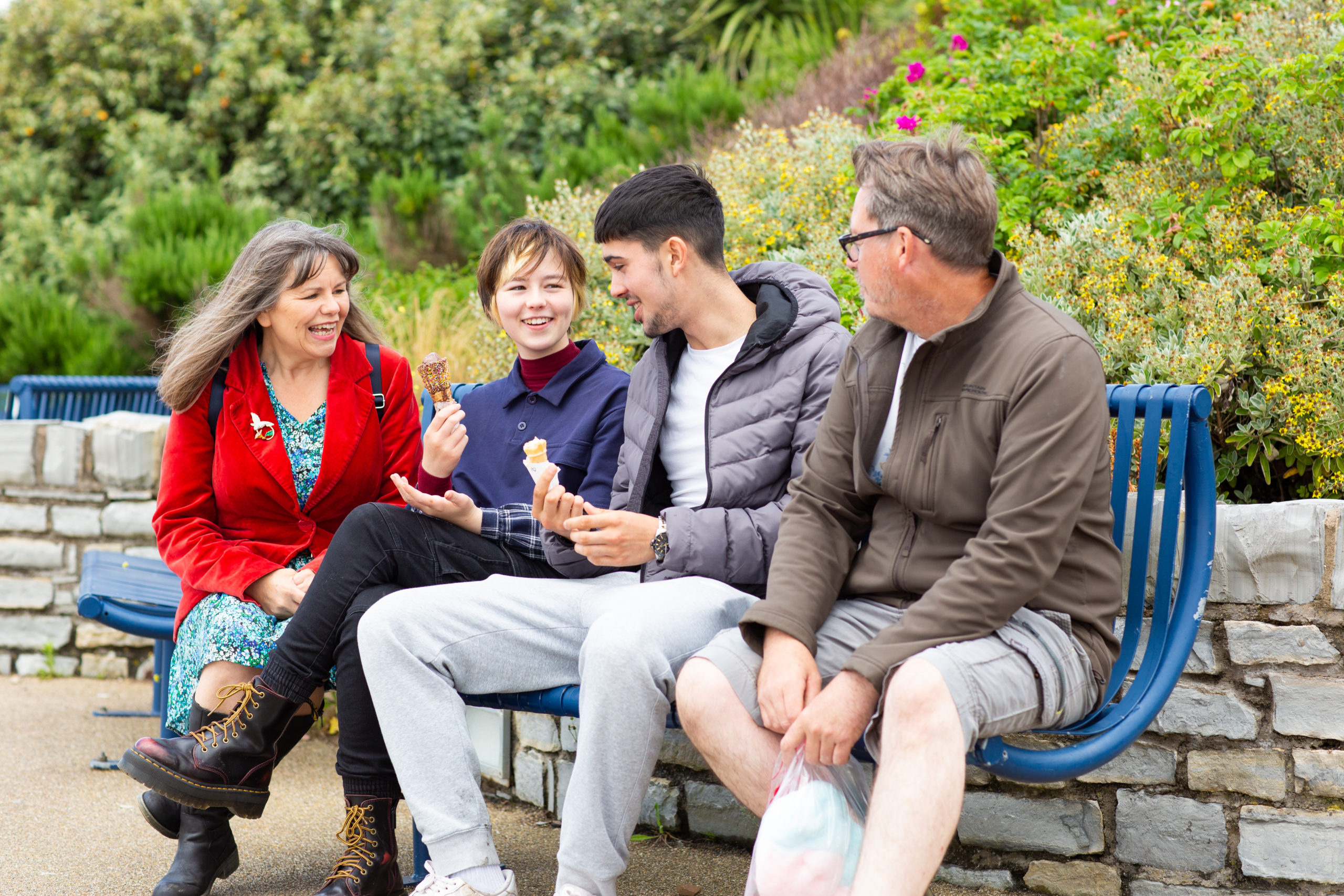 Family outdoors. Teenagers eating ice cream